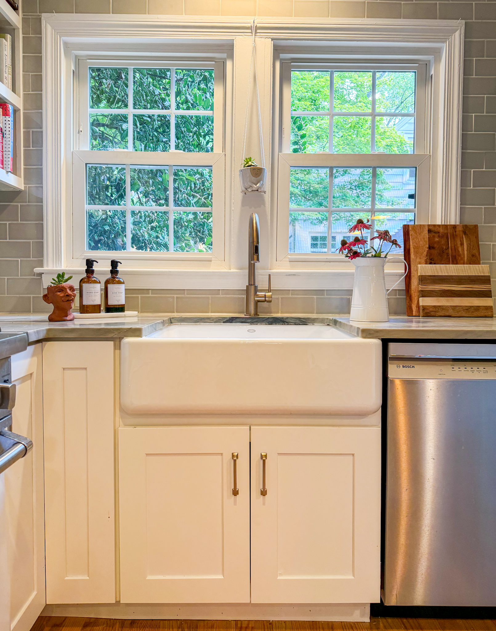 painting kitchen cabinets and adding trim around window
